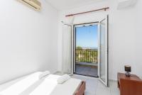 A bed or beds in a room at Villa Europe Thia