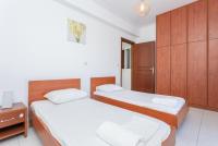 A bed or beds in a room at Villa Europe Thia