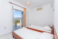 A bed or beds in a room at Villa Europe Thia