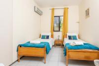 Postel nebo postele na pokoji v ubytování Villa Anemone