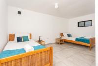 Postel nebo postele na pokoji v ubytování Villa Anemone