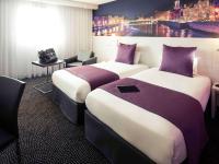 Hôtel Mercure Lyon Centre Charpennes Parc de la Tête d'Orにあるベッド