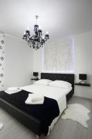 Postel nebo postele na pokoji v ubytování Apartments Taratta 1