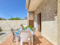 a table and chairs on the patio of a house at Apartment La Caterina-1 by Interhome in Saint-Cyr-sur-Mer