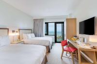 Ein Bett oder Betten in einem Zimmer der Unterkunft The Lodge at Gulf State Park, A Hilton Hotel