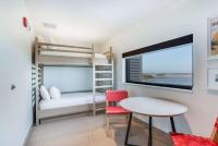 Ein Bett oder Betten in einem Zimmer der Unterkunft The Lodge at Gulf State Park, A Hilton Hotel