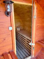 an inside view of a wooden cabin with a sauna at Maul - Lator vendégház in Villány