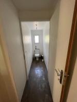 a hallway leading to a bathroom with a toilet at La Casba 15 mm plage Contis in Lévignacq