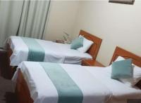 Postel nebo postele na pokoji v ubytování Al Jazeerah Hotel