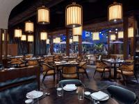 Ein Restaurant oder anderes Speiselokal in der Unterkunft Crockfords Las Vegas, LXR Hotels &amp; Resorts at Resorts World 
