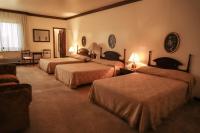 Rúm í herbergi á Nobile Suites Excelsior Asuncion