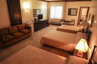 Rúm í herbergi á Nobile Suites Excelsior Asuncion