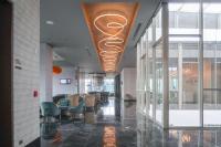 a lobby of a building with chairs and a ceiling at Gran Hotel Costa Rica, Curio Collection By Hilton in San José