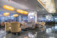 a lobby of a hotel with chairs and tables at Gran Hotel Costa Rica, Curio Collection By Hilton in San José