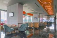 a lobby with chairs and tables in a building at Gran Hotel Costa Rica, Curio Collection By Hilton in San José