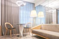 a living room with a couch and a table and chairs at Gran Hotel Costa Rica, Curio Collection By Hilton in San José