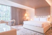 a hotel room with a bed and a table at Gran Hotel Costa Rica, Curio Collection By Hilton in San José