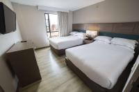Embassy Suites by Hilton Bogotá - Rosalesにあるベッド
