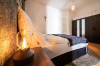 Postel nebo postele na pokoji v ubytování L45 Premium Apartment "IndustriaI" bis zu 5 Personen