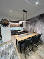 A kitchen or kitchenette at LUX apartmany Romantika CHOPOK 7, 19
