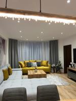 A seating area at LUX apartmany Romantika CHOPOK 7, 19
