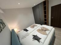 A bed or beds in a room at LUX apartmany Romantika CHOPOK 7, 19