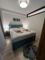 A bed or beds in a room at LUX apartmany Romantika CHOPOK 7, 19