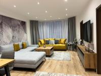 A seating area at LUX apartmany Romantika CHOPOK 7, 19