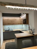 A kitchen or kitchenette at LUX apartmany Romantika CHOPOK 7, 19