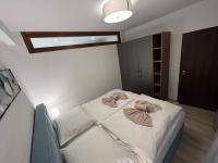 A bed or beds in a room at LUX apartmany Romantika CHOPOK 7, 19