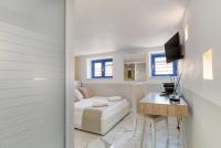 Televízia a/alebo spoločenská miestnosť v ubytovaní Spagna Dream Suites