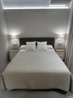 A bed or beds in a room at San Luis
