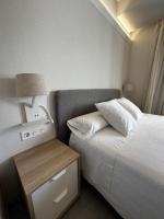 A bed or beds in a room at San Luis