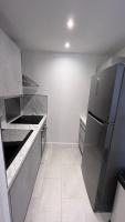 A kitchen or kitchenette at Haven of peace with balcony in Sainte-Maxime