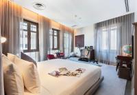 Ann Siang House, The Unlimited Collection managed by The Ascott Limitedにあるベッド