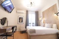 Postel nebo postele na pokoji v ubytování SUITES YOU Gran Vía