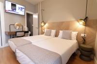 Postel nebo postele na pokoji v ubytování SUITES YOU Gran Vía
