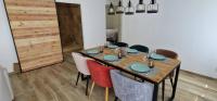 a dining room with a table and some chairs at Maison 4 A 6 Personnes in Belleville-sur-Mer