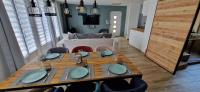 a dining room table with blue plates on it at Maison 4 A 6 Personnes in Belleville-sur-Mer