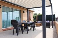 a black table and chairs on a patio at Estaque Cozy nest with a magical view of the sea in Marseille