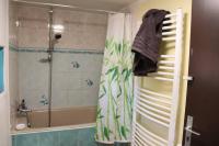 a bathroom with a shower and a shower curtain at Estaque Cozy nest with a magical view of the sea in Marseille
