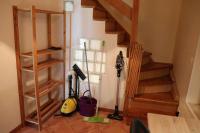 a room with wooden stairs and a room with tools at Estaque Cozy nest with a magical view of the sea in Marseille