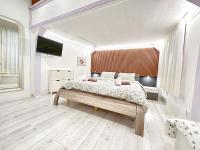 A bed or beds in a room at Yes, yes! lovely apartment good amenities Budapest center