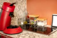 a red blender sitting on top of a counter at Perpignan - Appartement en centre ville in Perpignan