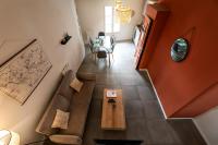 a living room with a couch and a table at Perpignan - Appartement en centre ville in Perpignan