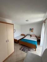 Posteľ alebo postele v izbe v ubytovaní Apartments Edina
