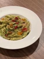 a white bowl of pasta with sauce on a plate at Delta Hotels by Marriott Basking Ridge in Basking Ridge