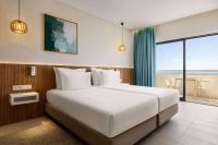 Postel nebo postele na pokoji v ubytování Wyndham Residences Alvor Beach