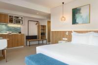 Postel nebo postele na pokoji v ubytování Wyndham Residences Alvor Beach