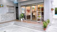 a store front with glass doors and potted plants at Sun B&amp;B in Taitung City
